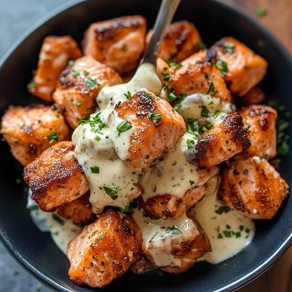 Whip up these delicious Air Fryer Salmon Bites in no time! These tender, flavorful bites are paired perfectly with a creamy garlic sauce that elevates each bite. Perfect for a quick weeknight dinner or a delightful appetizer at your next gathering. Save this recipe to impress your friends and family with an easy, yet gourmet dish!