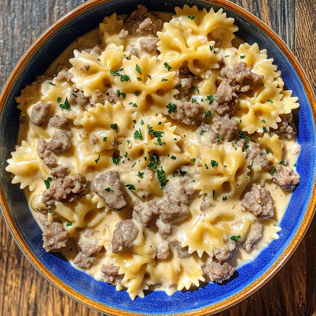 Creamy Beef and Bowtie Pasta is the perfect weeknight dinner! This comforting dish combines tender beef, bowtie pasta, and a rich, creamy sauce that everyone will love. Quick to make and packed with flavor, it's great for busy evenings or family gatherings. Save this recipe to enjoy a delicious meal any night of the week!