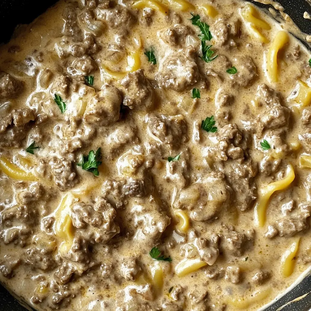 Comfort food at its finest! This Ground Beef Stroganoff is rich, creamy, and packed with flavors that the whole family will love. It's quick to prepare with simple ingredients like tender beef, mushrooms, and a luscious sauce served over egg noodles. Perfect for busy weeknights or cozy weekends. Don’t forget to save this recipe for your next family dinner!