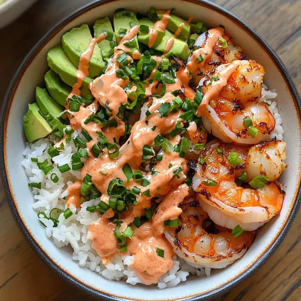 Craving a quick and tasty meal? These Shrimp Rice Bowls with Spicy Mayo bring together succulent shrimp, fluffy rice, and a zesty kick. Perfect for a weeknight dinner or meal prep, this dish bursts with flavor and can be customized to your liking. Save this recipe for a delicious and satisfying bowl any time!