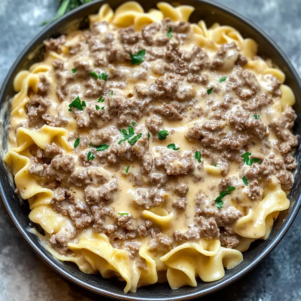 Creamy and comforting, this Ground Beef Stroganoff is your new weeknight hero! Featuring rich flavors and tender beef, this dish comes together in no time with everyday ingredients. Perfect served over egg noodles or rice for a satisfying meal. Save this recipe for a delicious family dinner or cozy nights in!