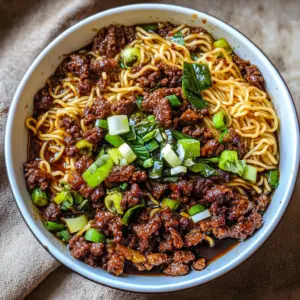 Satisfy your hunger with these delicious Mongolian Ground Beef Noodles! This easy recipe combines tender beef, fresh vegetables, and savory sauce for a quick weeknight meal. Perfect for busy nights or gatherings, this dish brings authentic flavors right to your table. Save this pin for a delightful dinner idea that's sure to impress!